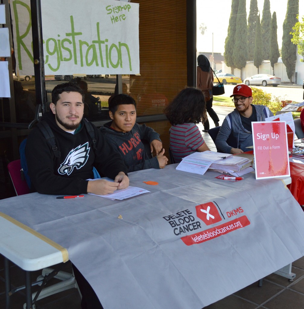 Students, staff, collecting monetary donations and registering participants.